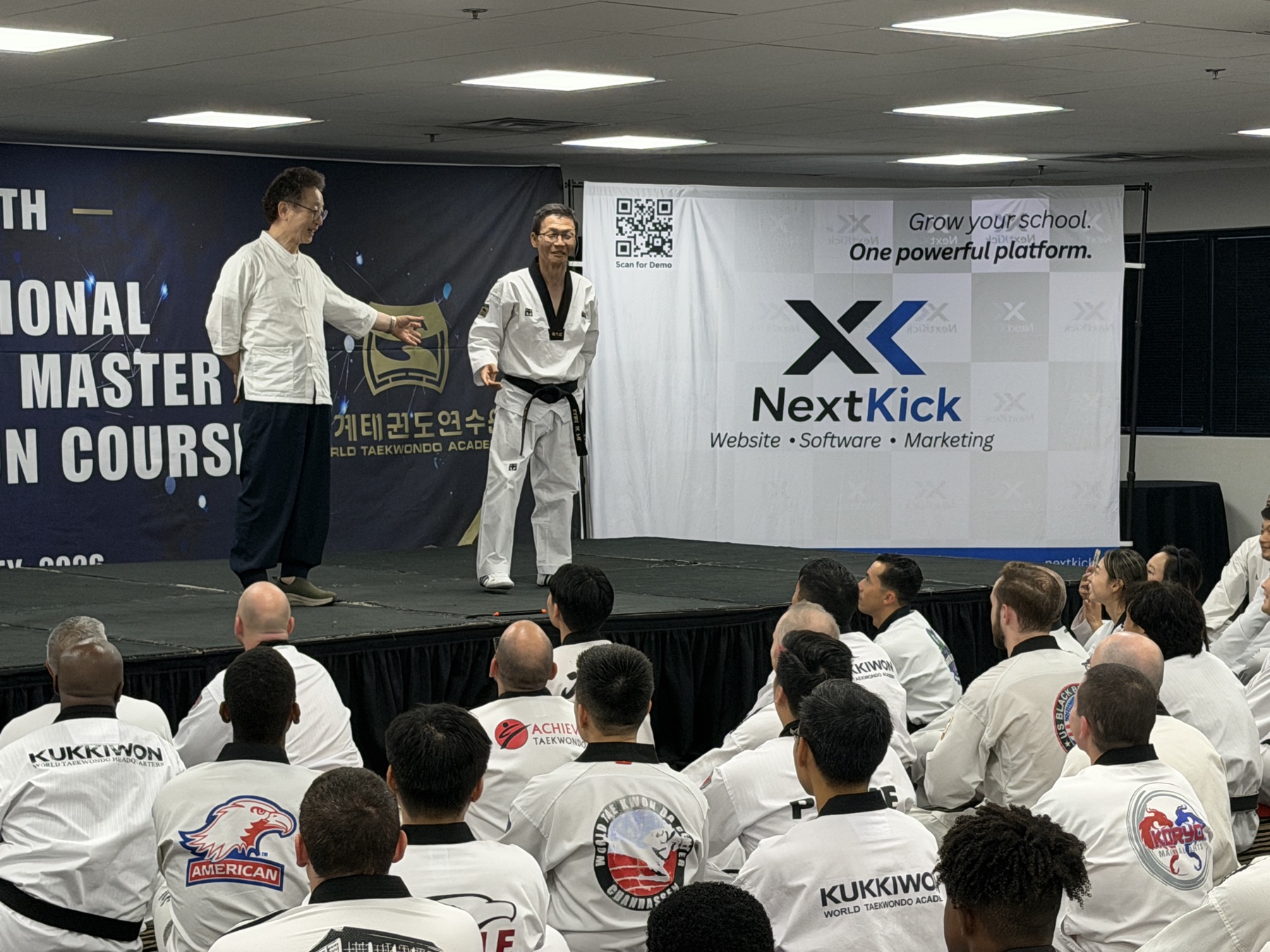 NextKick team greeting a new master at the event