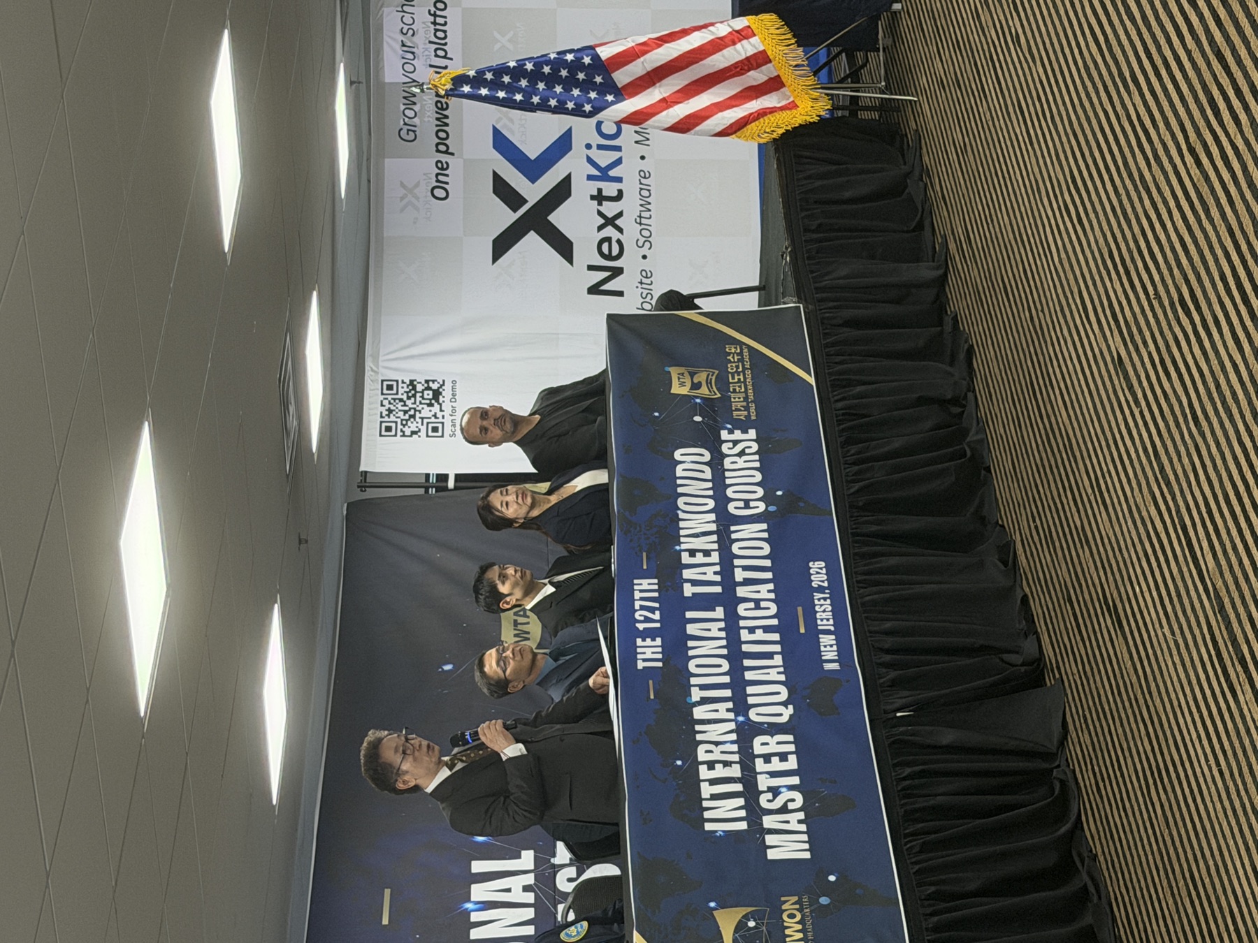 NextKick speaking on stage at the Master Qualification Course
